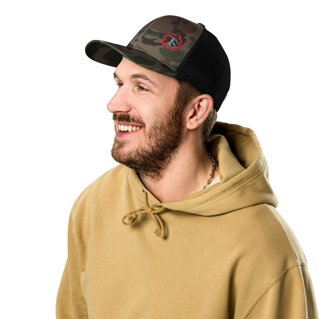 A guy wearing a camo hat with the TacSol Swirl logo